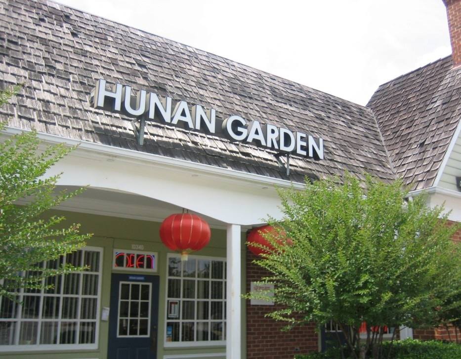 Outside of Hunan Garden, a Chinese restaurant in Chesterfield. Shingled roof, windows, and an open sign.